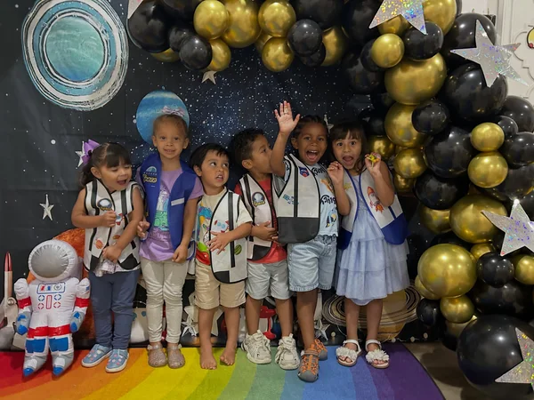 Children together at a space-themed PioPio special event